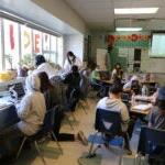 Students in Sam Egelhoff's fifth grade class at Thurgood Marshall meet in enrichment clusters around the classroom